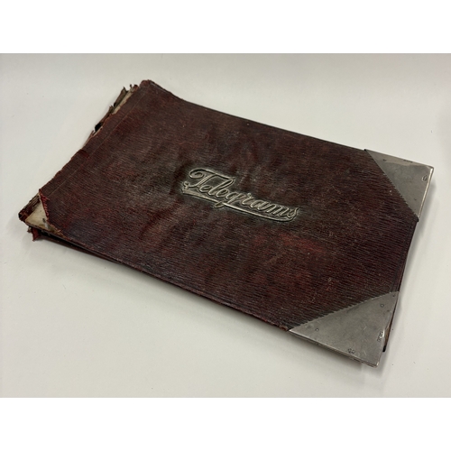 697 - A silver-mounted Telegrams book cover. London 1910. By Charles George Goord. Est. £20 - £30.