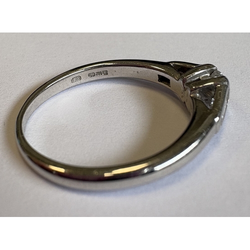 717 - A single-stone diamond ring in 18 carat white gold tapering mount. Approx. 4 grams. Est. £250 - £300... 