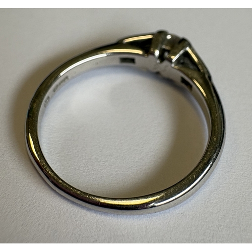 717 - A single-stone diamond ring in 18 carat white gold tapering mount. Approx. 4 grams. Est. £250 - £300... 