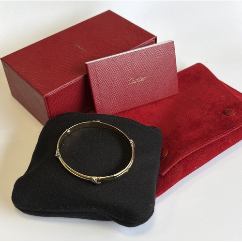 724 - CARTIER: A good 18 carat gold bracelet with concealed clasp complete with box and paperwork. Approx.... 