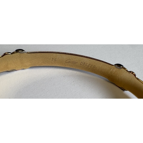 724 - CARTIER: A good 18 carat gold bracelet with concealed clasp complete with box and paperwork. Approx.... 