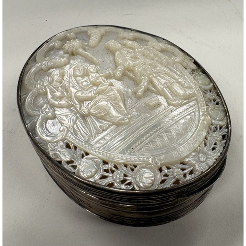470 - An early 19th Century Dutch silver snuff box with carved MOP decoration to cover. Approx. 179 grams.... 