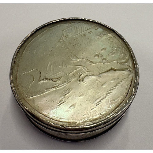 565 - A silver and MOP snuff box with lift-off cover carved with scene of dog and duck. Circa 1800. Approx... 