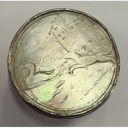 565 - A silver and MOP snuff box with lift-off cover carved with scene of dog and duck. Circa 1800. Approx... 