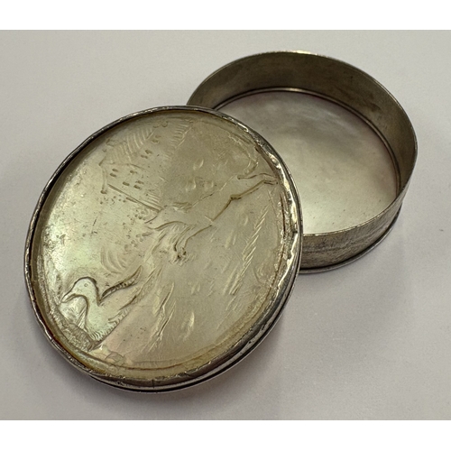 565 - A silver and MOP snuff box with lift-off cover carved with scene of dog and duck. Circa 1800. Approx... 
