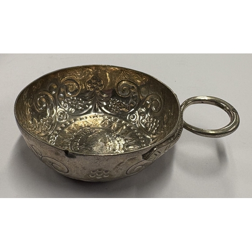 568 - A 19th Century French silver wine taster inset with coin to centre, marked to handle. Approx. 28 gra... 