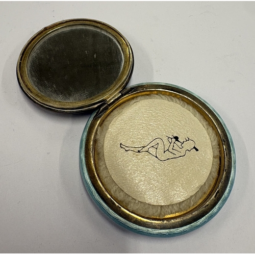 569 - An early 20th Century silver and blue enamelled compact depicting romantic scene to cover. Approx. 5... 
