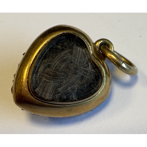 739 - A small heart-shaped enamel, pearl and rose diamond pendant. Approx. 4 grams. Est. £60 - £80.