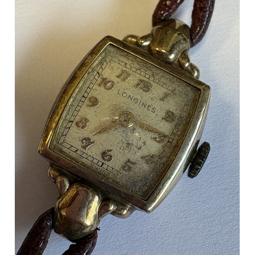 727 - A small gold Longines wristwatch in box. Est. £40 - £60.