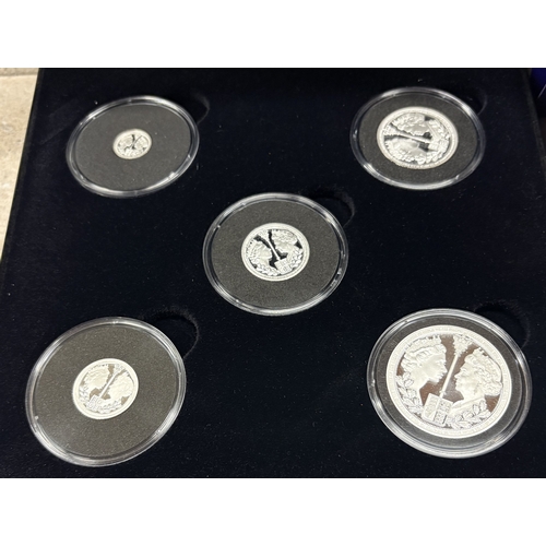 321 - A good silver five coin set in box. Est. £30 - £50.
