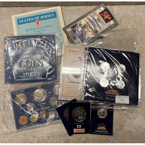 322 - A 2018 four coin set etc. Est. £20 - £30.