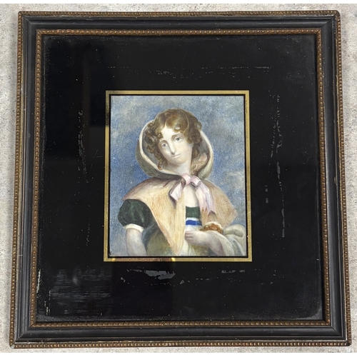 401 - A framed and glazed miniature portrait of a young lady wearing a bonnet and cape. Est. £50 - £80.