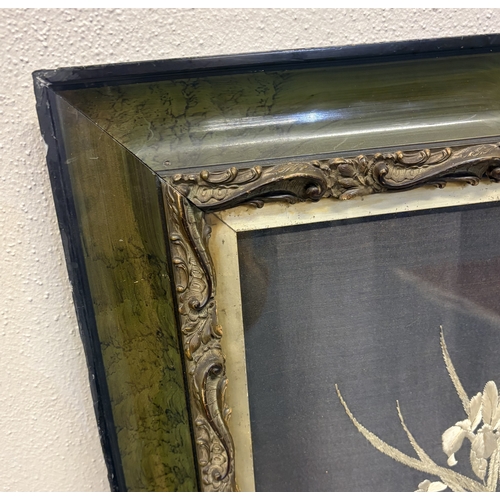 462 - A decorative framed and glazed silk picture depicting flowers. Approx. 68 cms x 55 cms (ss). Est. £2... 