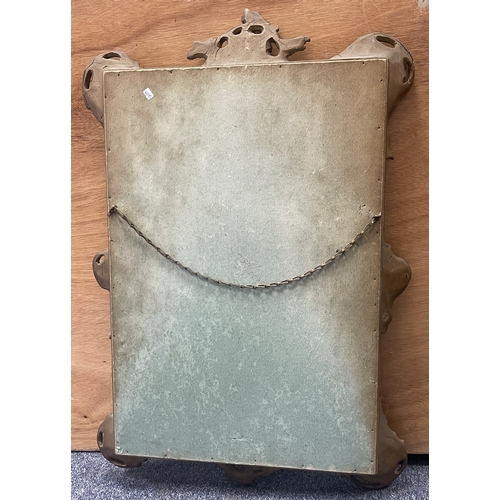 348 - An old gilded framed mirror. Approx. 42 cms x 62 cms. Est. £30 - £40.