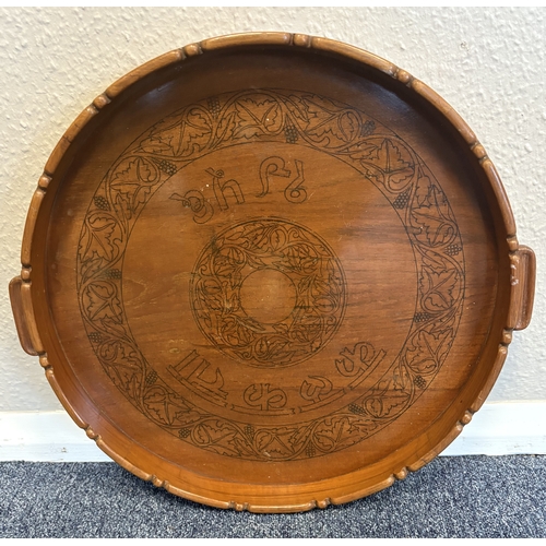 347 - A large circular hardwood script tray. Est. £10 - £20.