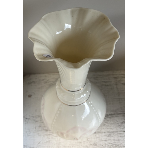346 - BELLEEK: A bulbous shaped cream vase with fluted splayed neck and pink floral decoration. Est. £20 -... 