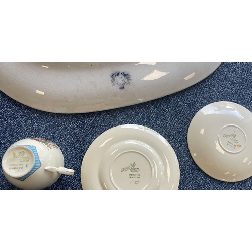 342 - A Clarice Cliff commemorative trio comprising teacup, saucer and tea plate. Together with a large me... 