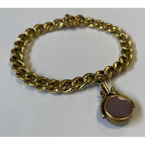 602 - A heavy 18 carat gold curb link bracelet with concealed clasp to compass fob. Approx. 18 grams. Est.... 