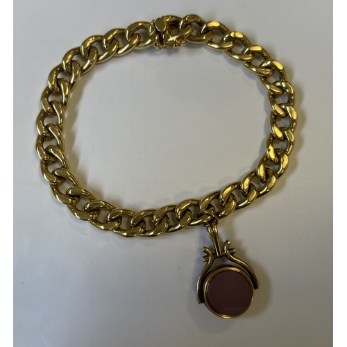 602 - A heavy 18 carat gold curb link bracelet with concealed clasp to compass fob. Approx. 18 grams. Est.... 