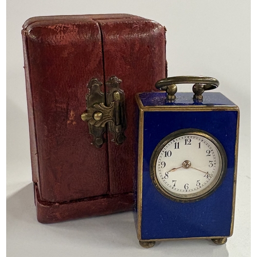 47 - An early 20th Century metal and enamelled clock in case. Est. £500 - £800.