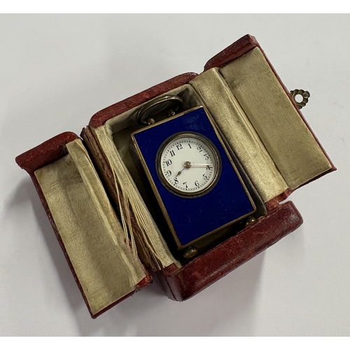 47 - An early 20th Century metal and enamelled clock in case. Est. £500 - £800.