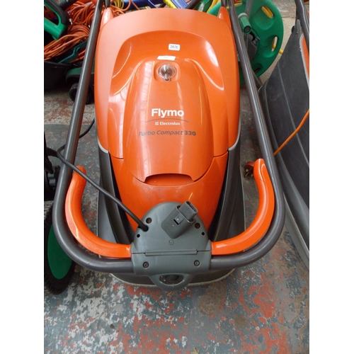 138 - AN ORANGE FLYMO TURBO COMPACT 330 ELECTRIC HOVER MOWER