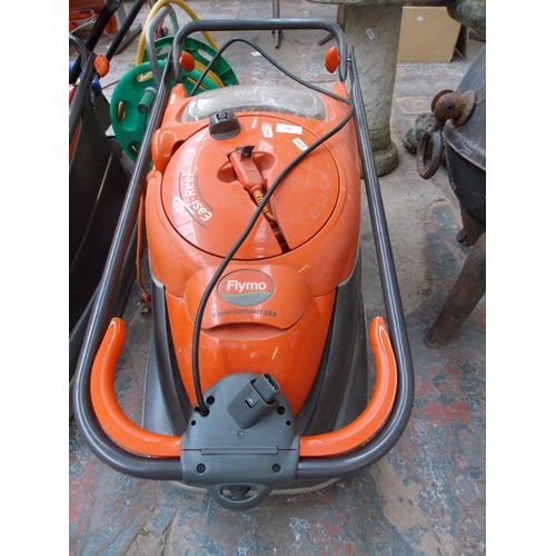 139 - AN ORANGE FLYMO VISION COMPACT 350 ELECTRIC HOVER MOWER W/O