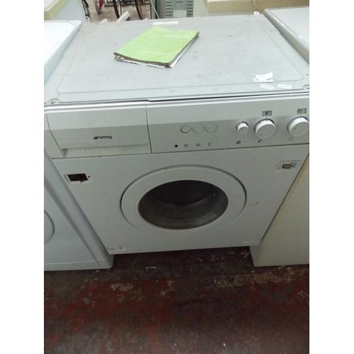 172 - A SMEG INTEGRATED WASHING MACHINE W/O