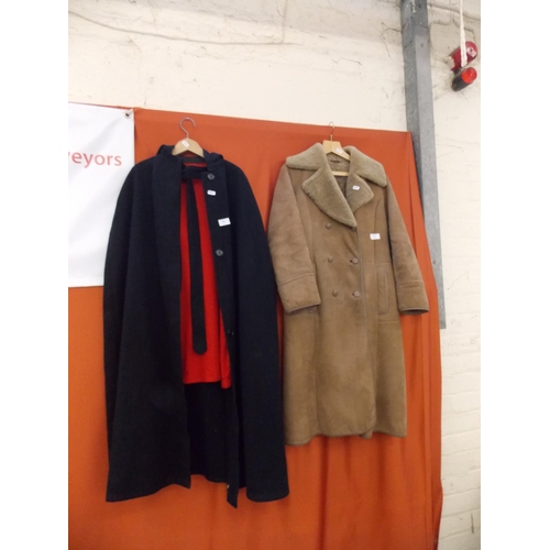 280 - A VINTAGE NURSES BLACK AND RED CAPE AND A SHEEP SKIN JACKET