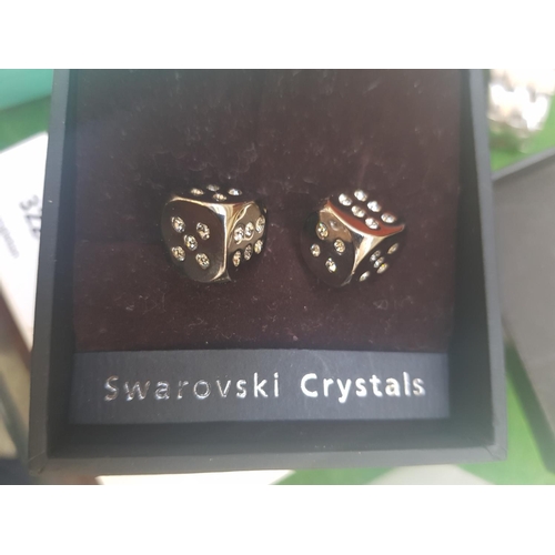 324 - A PAIR OF SWAROVSKI CRYSTALS CUFF LINKS