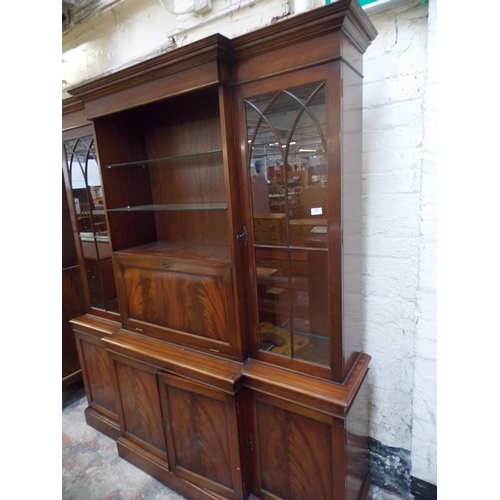 380 - A LARGE TETRAD FLAMED MAHOGANY DRESSER WITH TWO GLASS DOORS, FOUR DOORS AND TWO GLASS SHELVES