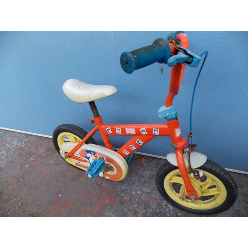 12 - TWO CHILDS BMXS - ONE RED POSTMAN PAT AND ONE BLUE DRAGON