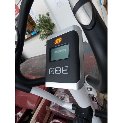 45 - A WHITE JFT CROSS TRAINING MACHINE WITH DIGITAL READOUT