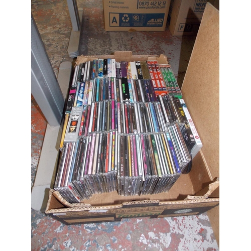176 - A BOX CONTAINING MIXED CD'S AND DVD'S