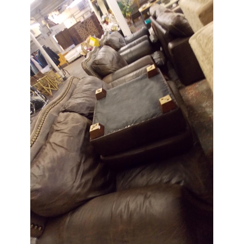 482 - A LEATHER TWO SEATER SOFA, TWO MATCHING ARM CHAIRS AND A FOOTSTOOL