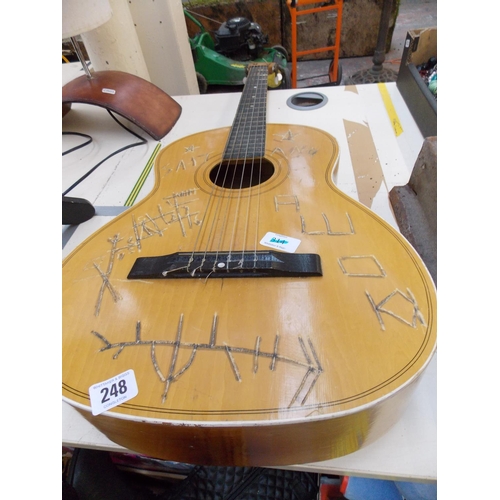 201 - AN ACOUSTIC GUITAR