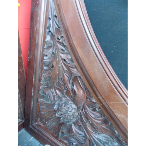 1009 - A PAIR OF HEAVILY CARVED MAHOGANY CHURCH PANELS