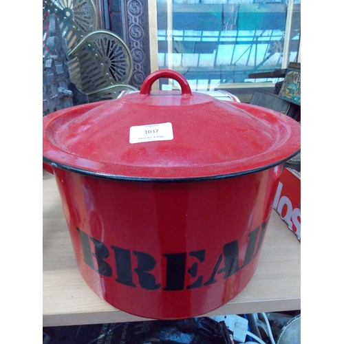 1037 - TWO ITEMS TO INCLUDE A RED AND BLACK ENAMEL POLISH BREAD BIN AND A VINTAGE RED AND WHITE METAL BREAD... 