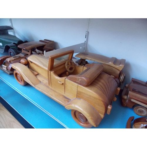 1127 - A COLLECTION OF SIX HANDMADE WOODEN VINTAGE CAR MODELS