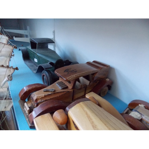 1127 - A COLLECTION OF SIX HANDMADE WOODEN VINTAGE CAR MODELS