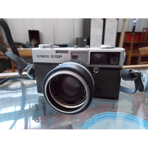 1180 - TWO ITEMS - A RARE GERMAN LEICA WETZLAR FILM CAMERA IN ORIGINAL CASE AND AN OLYMPUS 35SP FILM CAMERA... 