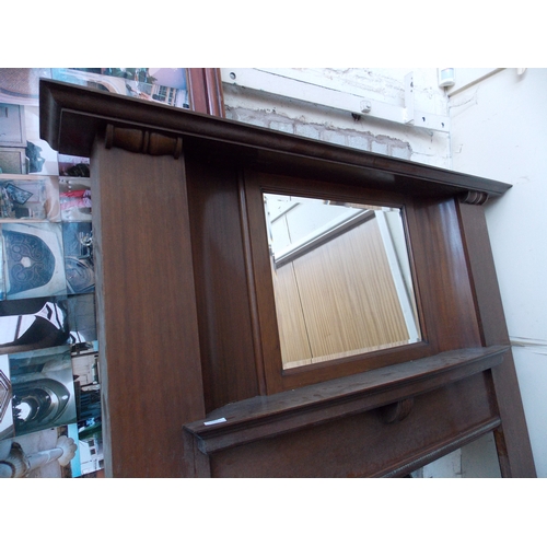 1267 - A TALL MAHOGANY FIRE SURROUND WITH BEVEL EDGED MIRROR TOP