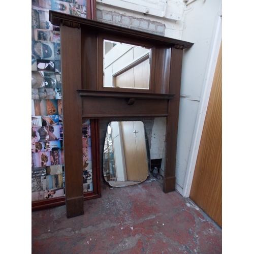 1267 - A TALL MAHOGANY FIRE SURROUND WITH BEVEL EDGED MIRROR TOP