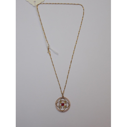 406 - A 9 CARAT GOLD RED STONE PEARL PENDANT