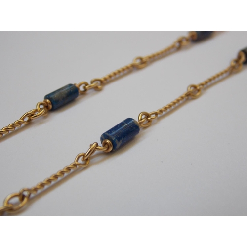 407 - A 9 CARAT GOLD BLUE STONE NECKLACE