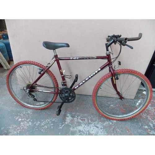 16 - A RED RALEIGH NITRO BOYS MOUNTAIN BIKE WITH 10 SPEED SHIMANO GEAR SYSTEM