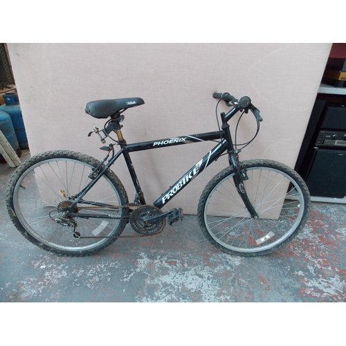 17 - A BLACK PROBIKE PHOENIX GENTS MOUNTAIN BIKE WITH 15 SPEED SHIMANO GEAR SYSTEM