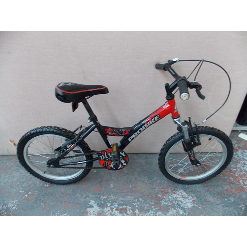 23 - A BLACK AND RED PROBIKE NINJA BMX STYLE BIKE WITH FRONT SUSPENSION