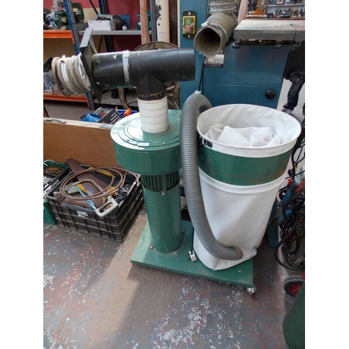 127 - A GREEN AXMINSTER MAINS ELECTRIC DUST EXTRACTION UNIT IN W/O