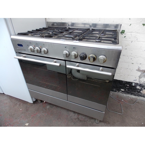 166 - A STAINLESS STEEL 90 CM DUAL FUEL RANGE COOKER WITH FIVE GAS HOBS, DOUBLE OVEN AND ONE FAN W/O